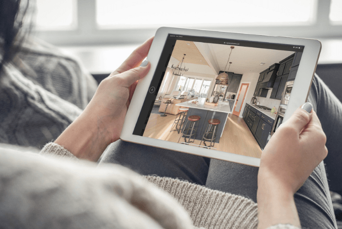 build your home online. iPad looking at photos. 
